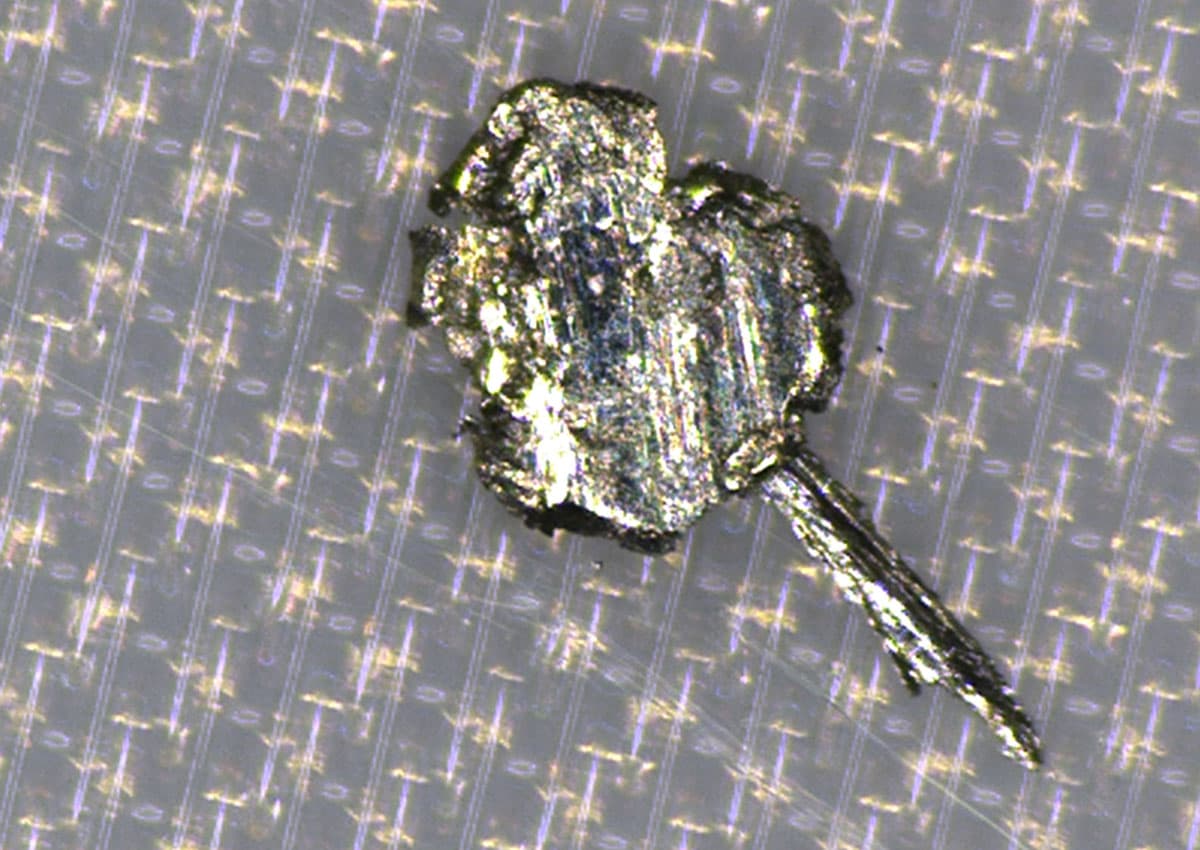 Metallic particle on component surface