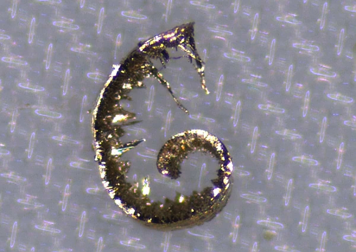 Metallic particle on component surface
