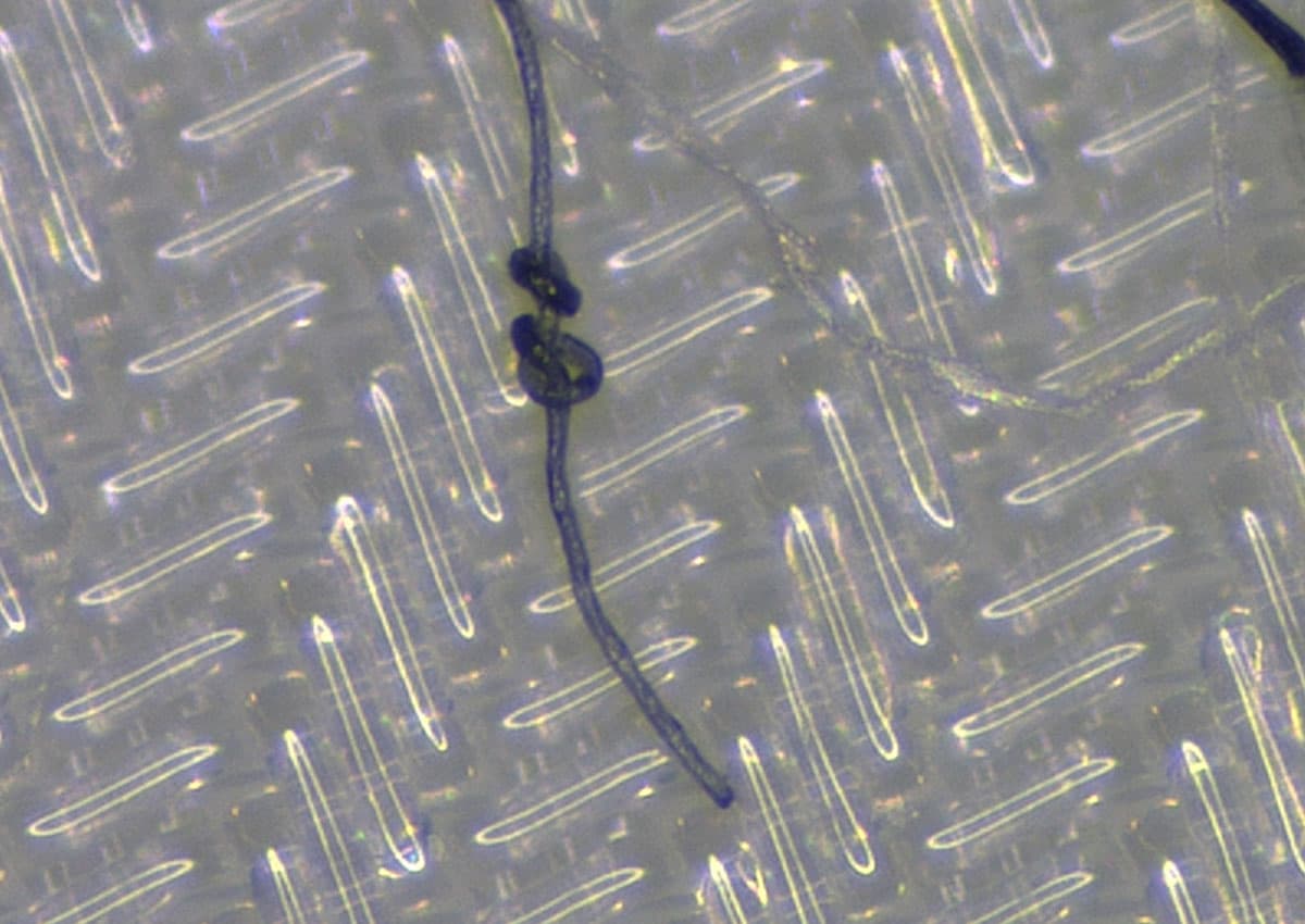 Fiber on particle surface